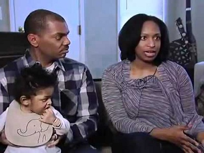 Keenan with his wife and child